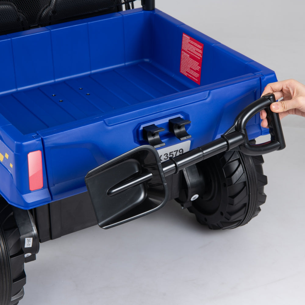 Close-up of the electric dump bed handle on the 24V kids ride-on dump truck, designed for interactive outdoor play.