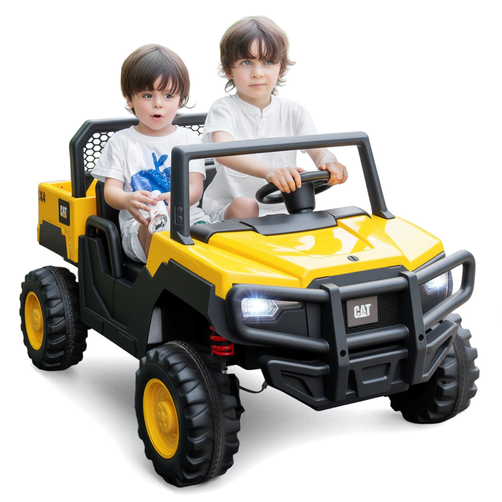 Two children driving a yellow 24V licensed Caterpillar ride-on dump truck, designed for outdoor fun.
