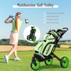 Folding golf push cart in green with adjustable handle, swivel wheels, and scoreboard holder for easy course navigation.