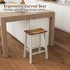 Saddle stool with ergonomic curved seat and acacia wood construction, perfect for kitchen islands and dining areas.