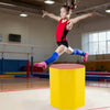 Young gymnast leaping over a 24.5-inch yellow octagon gymnastics mat, ideal for training and safe practice.