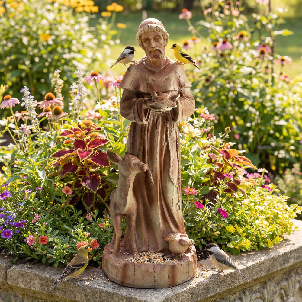 St. Francis statue with bird feeder in rustic brown, featuring a fawn and birds, perfect for garden decoration.