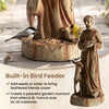 St. Francis statue with built-in bird feeder in rustic brown, perfect for attracting birds and enhancing garden decor.