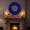 24-inch pre-lit artificial Christmas wreath with 50 warm white LED lights and natural pine cones, perfect for festive decor.