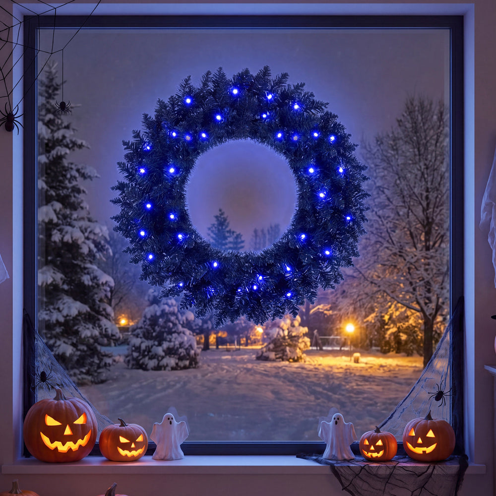 24-inch pre-lit artificial Christmas wreath with 50 LED lights and natural pine cones, perfect for festive front door decor.