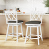Single 24-inch white counter height barstool featuring a curved backrest and black cushion, perfect for modern dining.