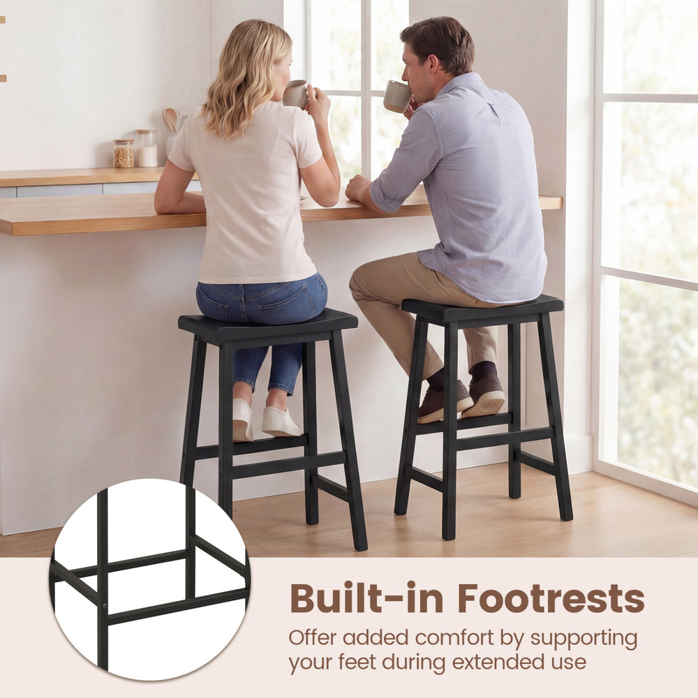 Backless 24-inch black saddle bar stools with built-in footrests, perfect for kitchen island seating and space-saving.