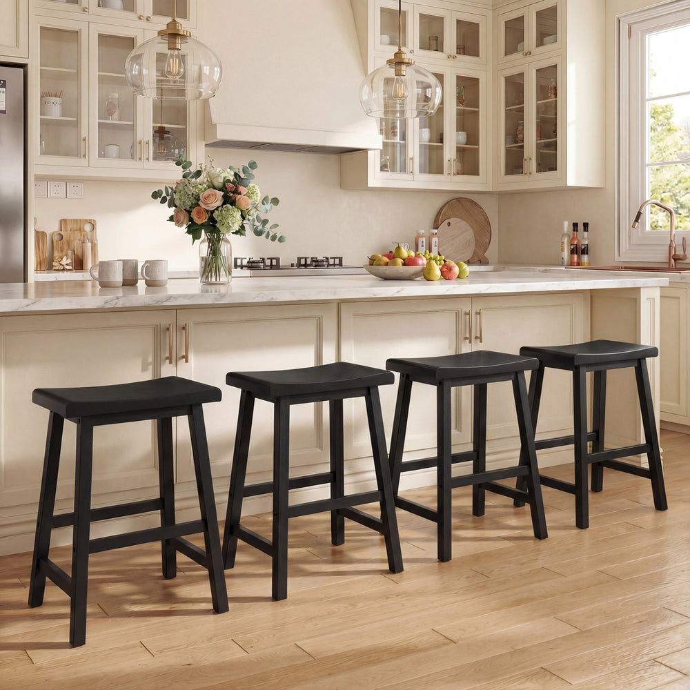 Set of four black 24-inch counter height stools with solid wood saddle seats, ideal for kitchen island seating.