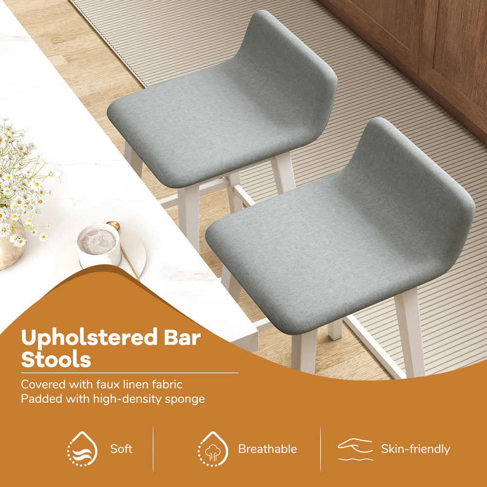 Set of 2 low back 24-inch bar stools in gray faux linen fabric, padded for comfort, ideal for kitchen islands.