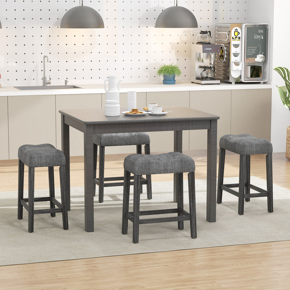 Set of 2 gray saddle bar stools with padded seats, featuring a solid rubber wood frame and button-tufted design for.