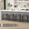Set of 2 gray saddle bar stools with padded seats, featuring a space-saving design for easy under-counter storage.