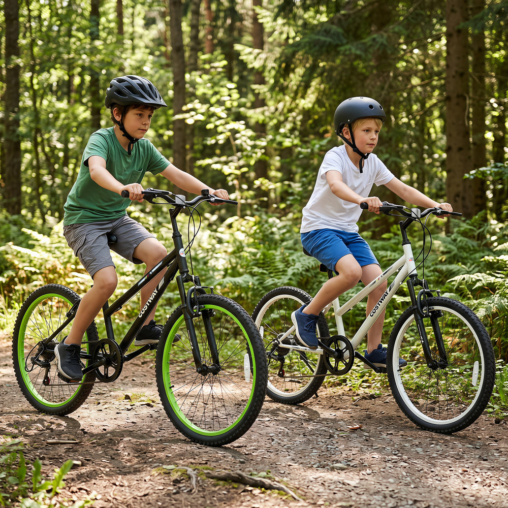 Two kids riding 24-inch adjustable mountain bikes with 7-speed gears and suspension forks on a forest trail.