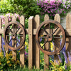 Decorative 24-inch wooden wagon wheels made of carbonized fir wood, enhancing rustic charm for indoor and outdoor.