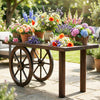 Decorative wooden wagon wheel table made of carbonized solid fir wood, perfect for rustic indoor and outdoor decor.