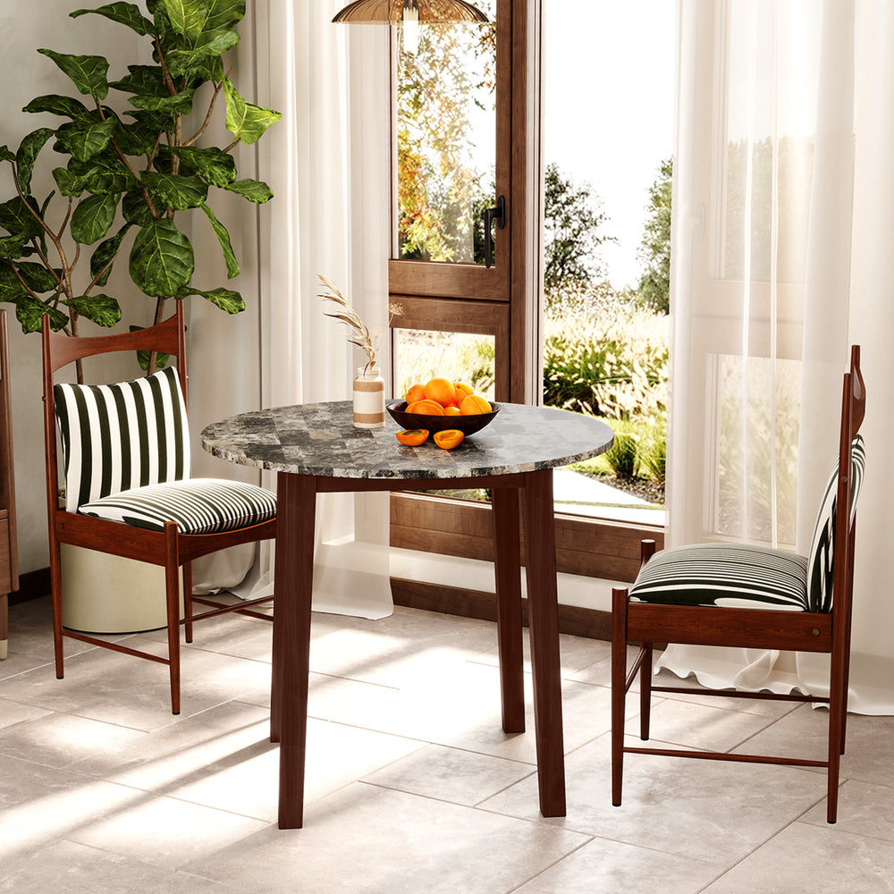 Round dining table with marble-textured veneer and rubber wood legs, ideal for dining or working in a stylish setting.