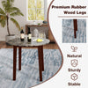 Round dining table with marble-textured veneer and sturdy rubber wood legs, ideal for dining and workspace use.