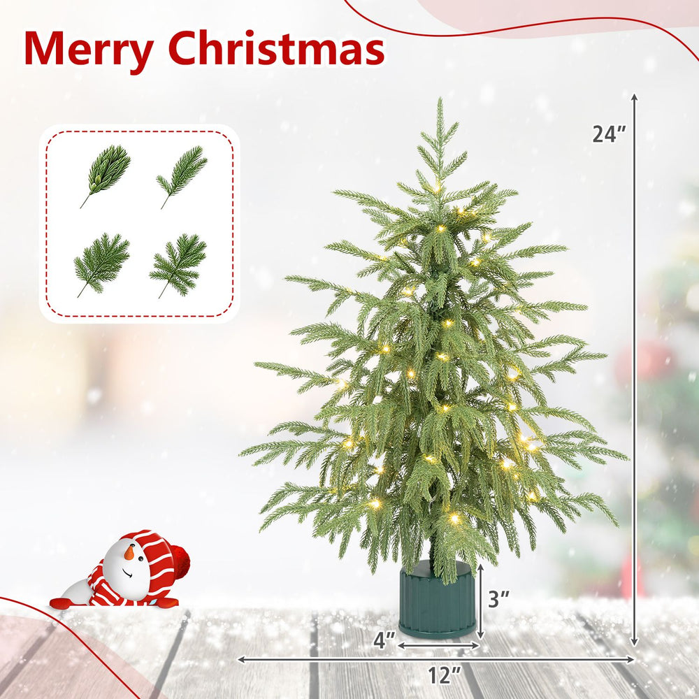 24" pre-lit tabletop Christmas tree with rotating musical base, featuring 35 LED lights and realistic PE branch tips.