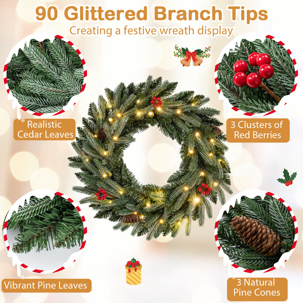 24” pre-lit Christmas wreath featuring 90 glittered branch tips, red berries, and natural pine cones for festive decor.