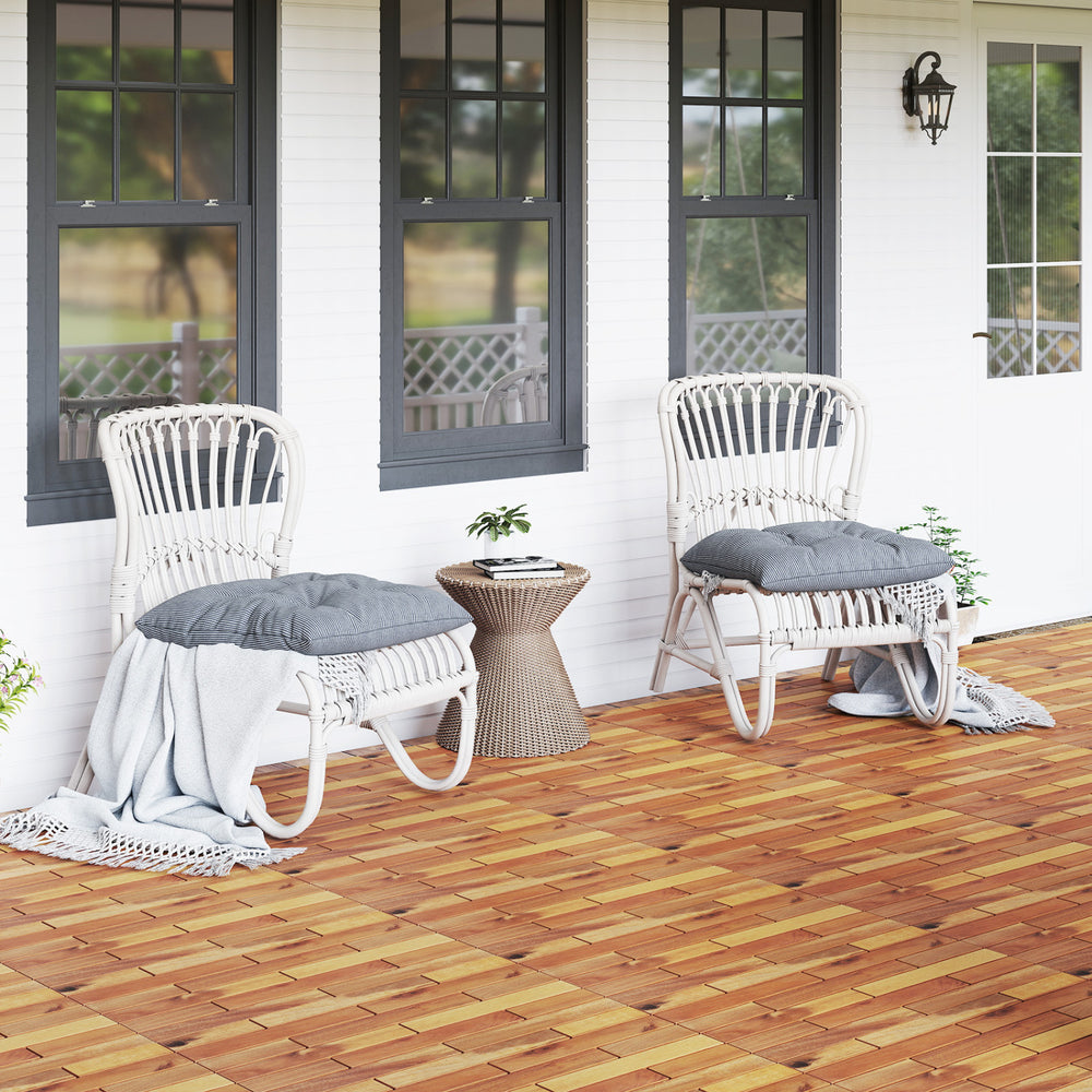 Acacia wood interlocking deck tiles in a natural finish, showcasing a waterproof design for outdoor spaces.