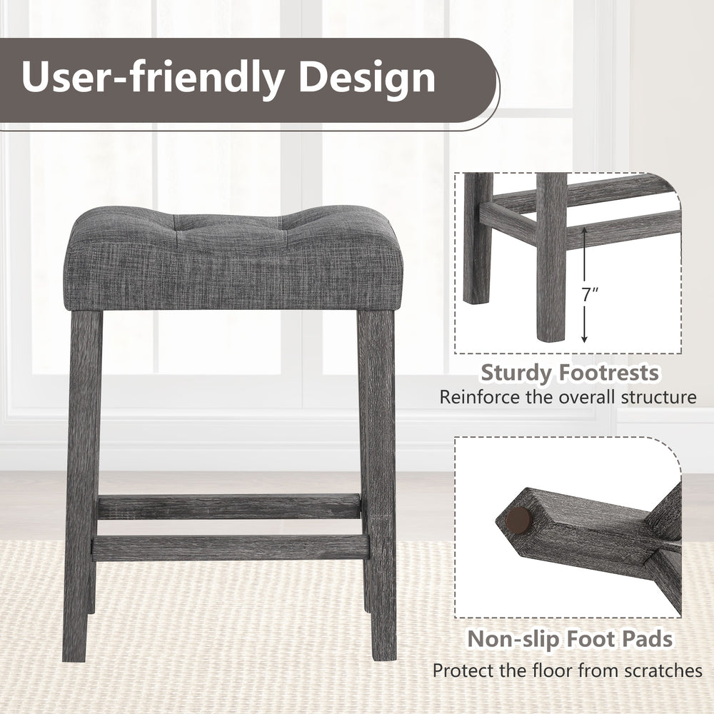 Gray 24-inch saddle bar stool with padded seat, button-tufted design, and non-slip foot pads for floor protection.