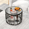 24-inch round coffee table with reeded tempered glass top and black oval swivel brackets, perfect for stylish living.