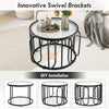 24-inch round coffee table showcasing reeded tempered glass top and unique black oval swivel brackets for customizable.