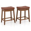 Set of 2 upholstered PU leather bar stools with saddle seat, vintage button tufting, and sturdy rubber wood legs.