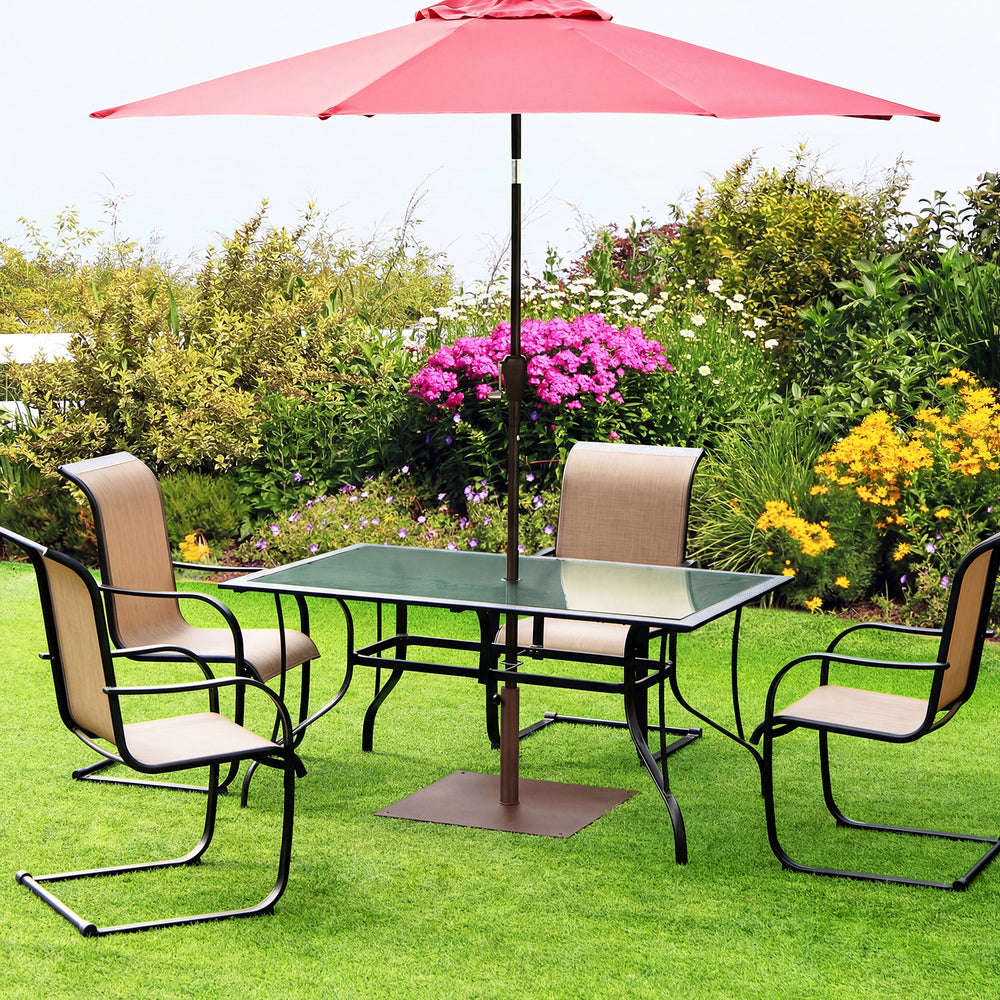 Square patio umbrella base made of powder-coated steel, 42 lbs, designed for stability under outdoor tables.