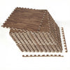 Brown wood grain foam floor mats stacked with borders, ideal for creating a comfortable flooring solution.