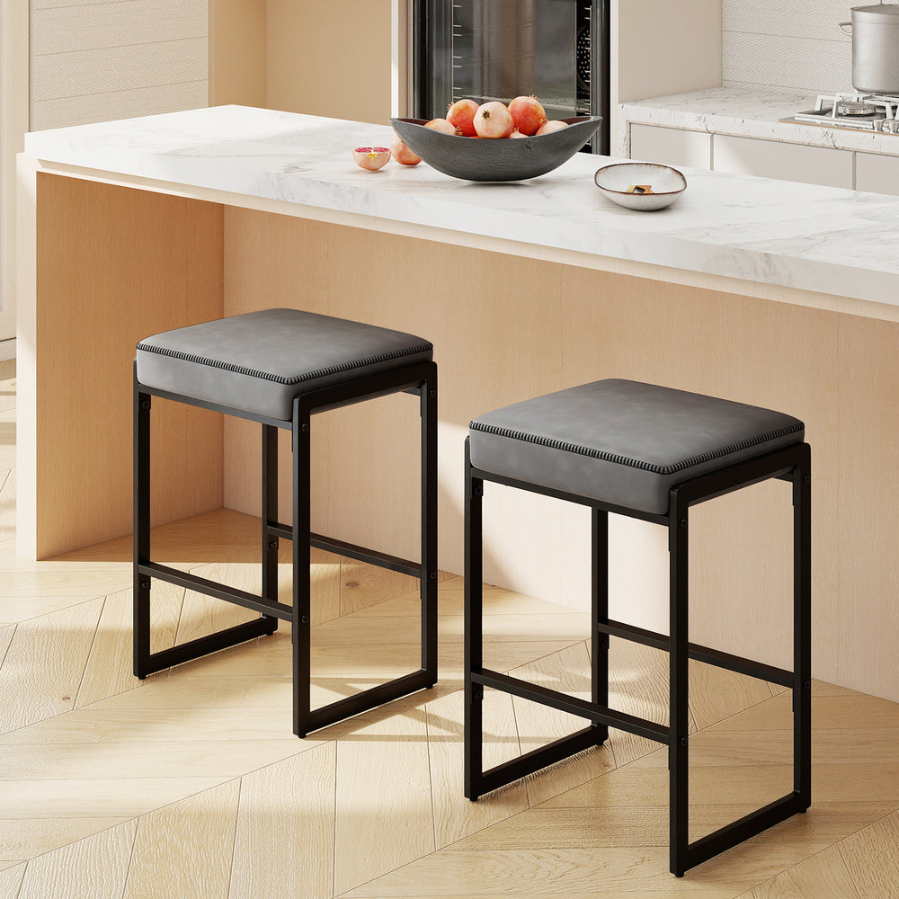 Gray 26-inch bar stools set of 2 with faux leather seats and sturdy metal frames, perfect for kitchen islands.