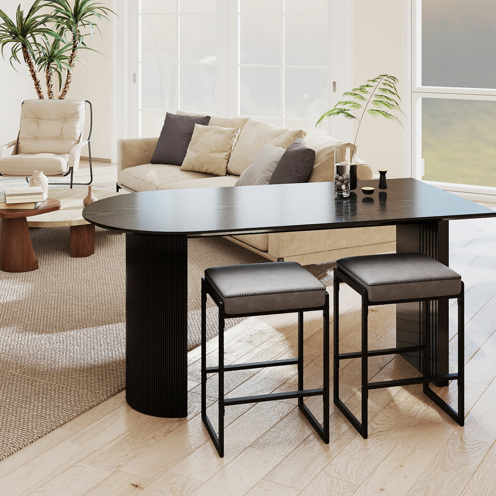 Gray 26-inch bar stools with faux leather seats and footrests, perfect for kitchen islands and home bars.