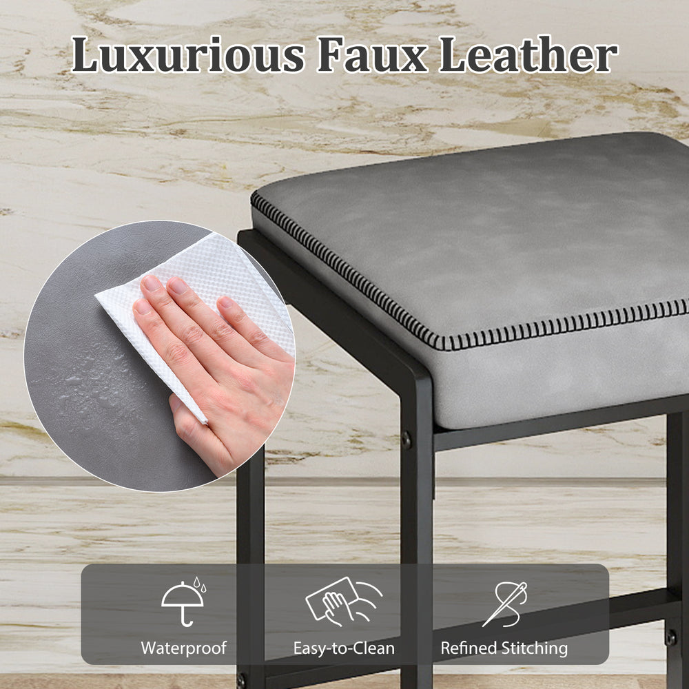 Close-up of the 26-inch gray bar stool with waterproof faux leather seat, showcasing refined stitching and easy.