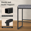 Gray faux leather upholstered bar stool with heavy-duty metal frame and adjustable foot pads for kitchen counter height.
