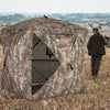 270° see-through hunting blind tent with silent magnetic door, designed for stealth and easy setup in the wilderness.