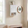 Wall-mounted bathroom storage cabinet in white with adjustable shelves, ideal for organizing small spaces and enhancing decor.