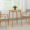 Round bamboo dining table for 2-4 people with smooth corners, perfect for small spaces in living rooms or kitchens.