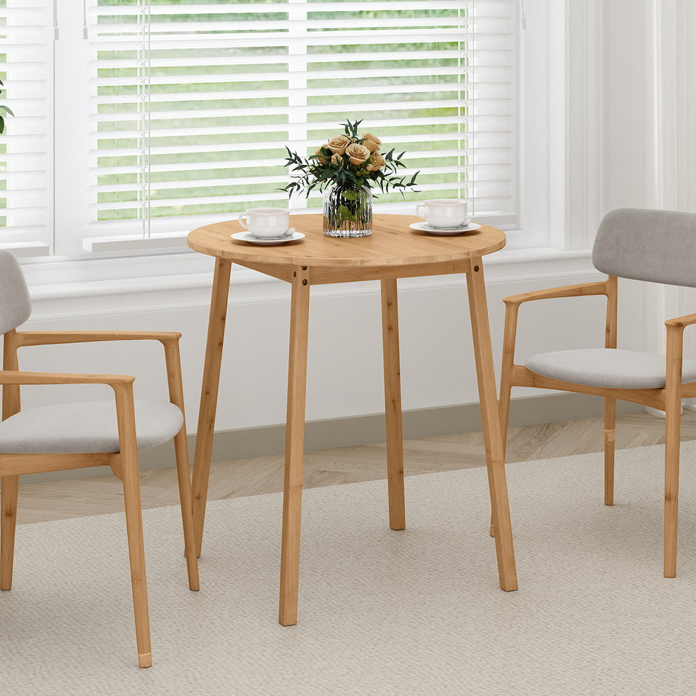 Round bamboo dining table for 2-4 people with smooth corners, perfect for small spaces in living rooms or kitchens.