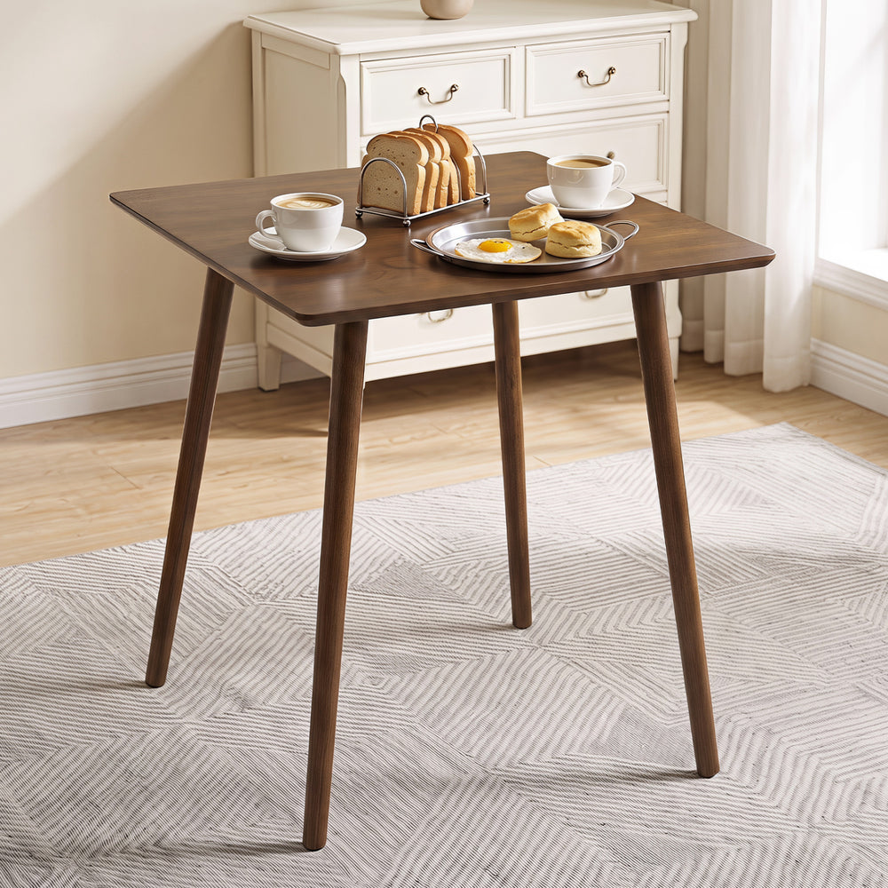 Small square wooden dining table in walnut finish, seats 2-4, perfect for space-saving dining in compact areas.