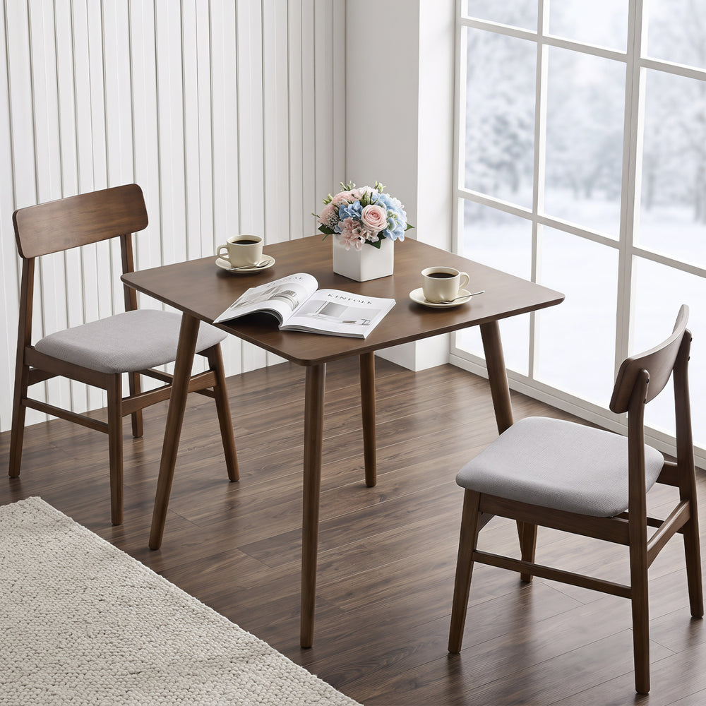 Small square walnut dining table with rounded corners, seats 2-4, perfect for compact dining spaces.