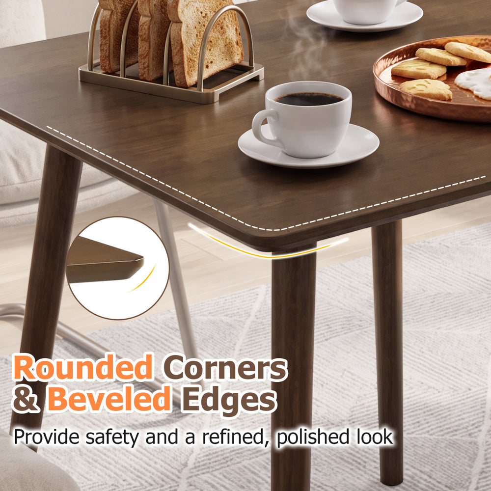 Small square wooden dining table with rounded corners and beveled edges, perfect for 2-4 people in compact spaces.