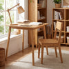 Square bamboo dining table for 2-4 people with a natural finish, ideal for compact spaces and mid-century style.