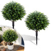 27.5 inch artificial cypress topiary tree with ground spikes, featuring dense foliage for outdoor decoration and easy relocation.