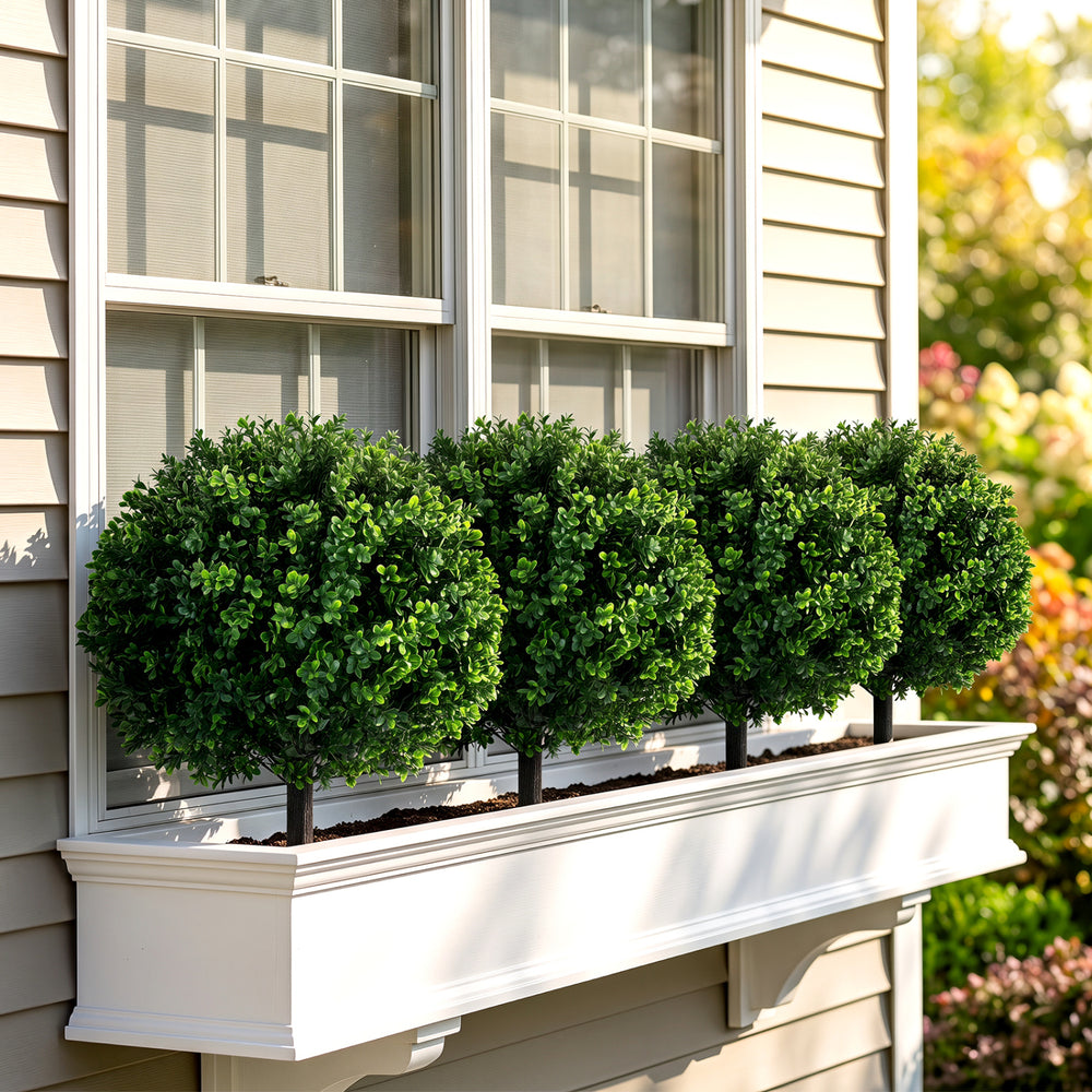 Set of 2, 27" artificial boxwood topiary trees with dense foliage and sturdy ground spikes for outdoor decor.