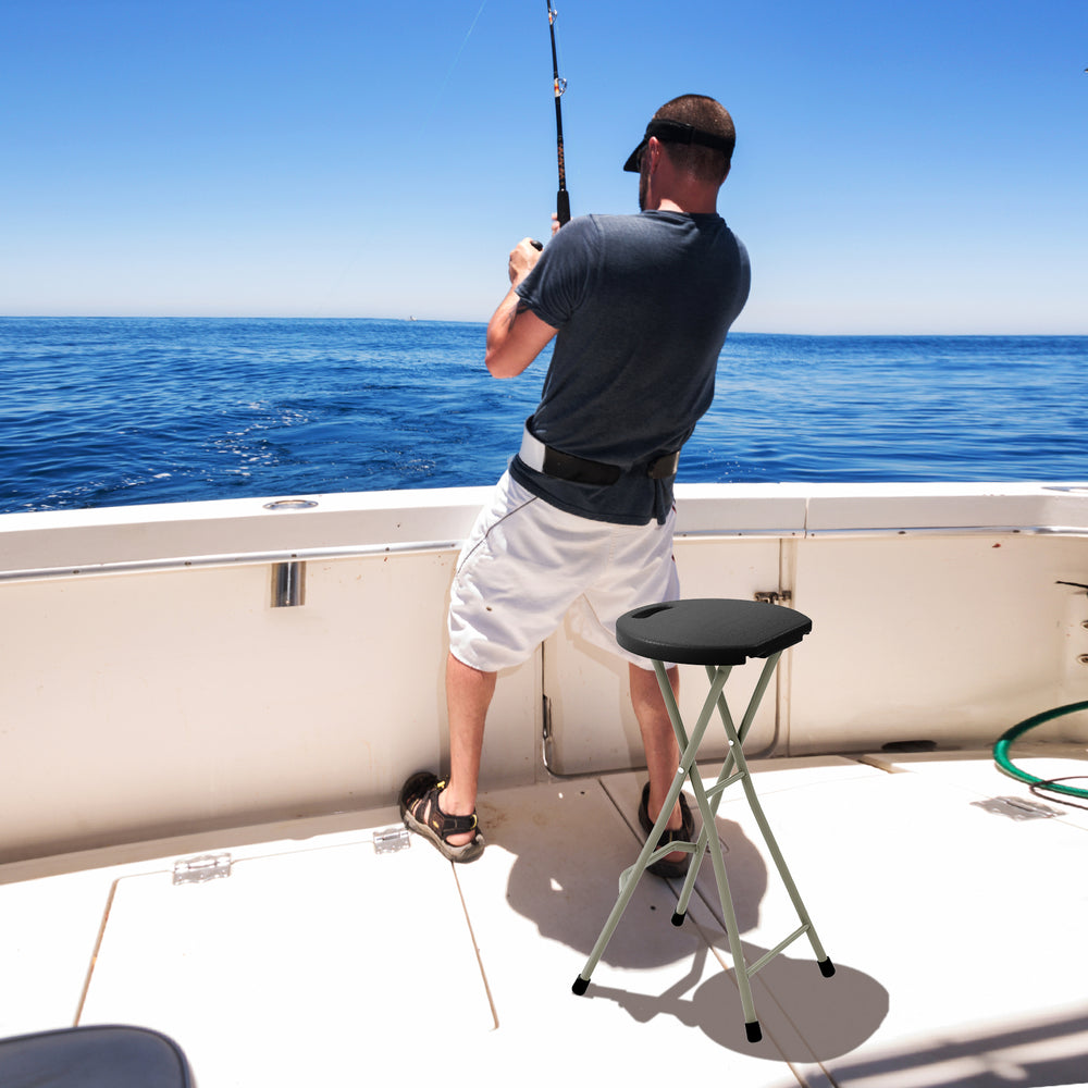 Portable folding stool with a sturdy frame, ideal for fishing, featuring a wide seat and footrests for comfort.