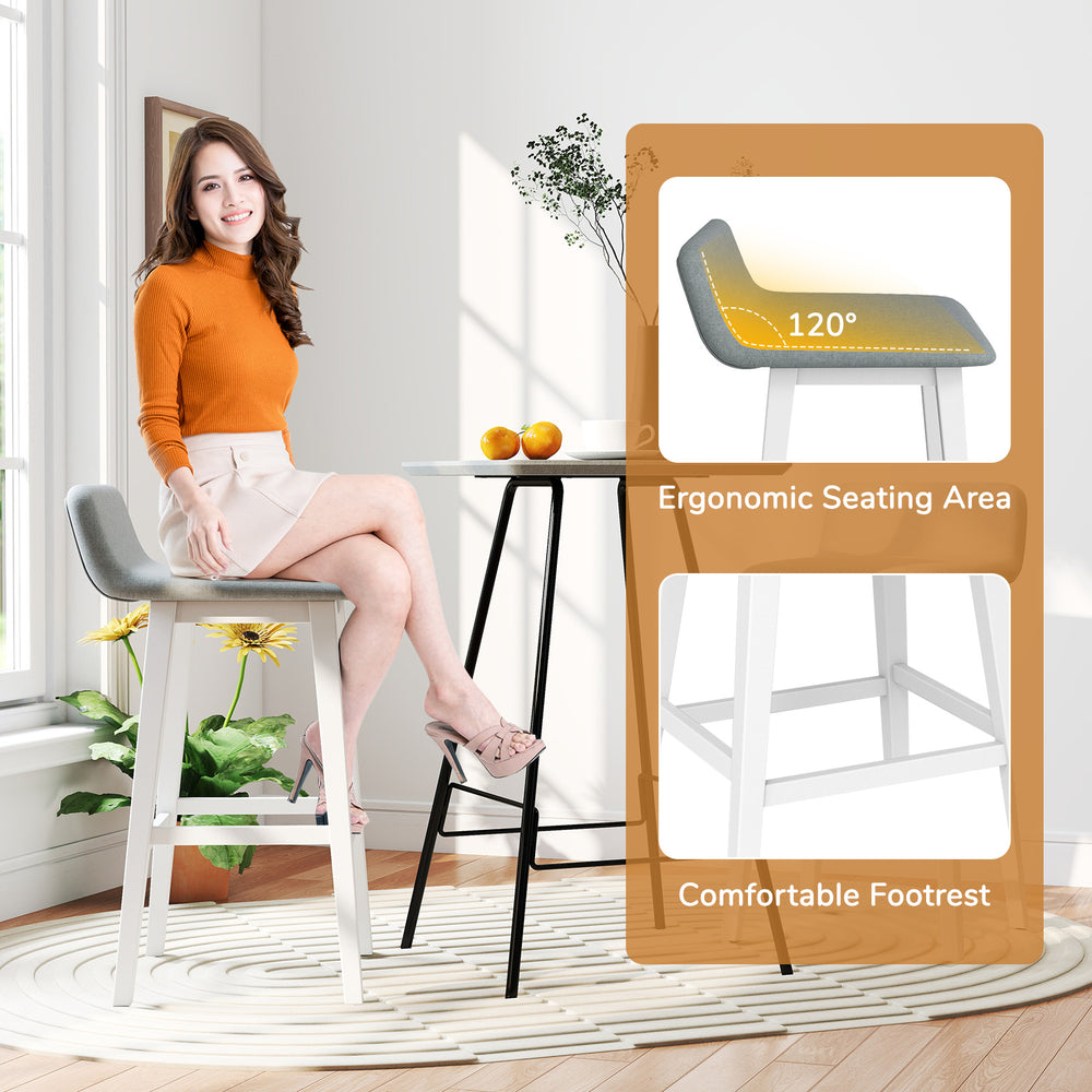 Low-back high-top chair with padded seat, rubber wood legs, and built-in footrest for dining room or kitchen use.