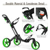 Folding golf push cart with green wheels, adjustable handle, and built-in scoreboard holder for easy course navigation.