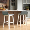 Low-back high-top chairs with padded seats and rubber wood legs, perfect for kitchen or home bar use.