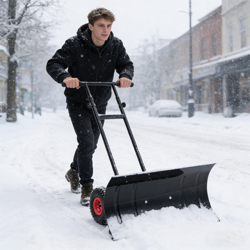 29-inch heavy-duty metal snow pusher with wheels, adjustable handle, and anti-slip grips for efficient snow clearing.