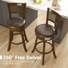 Set of 2 brown 29-inch swivel barstools with rattan backrest and footrest, ideal for kitchen islands and dining areas.