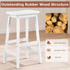 Counter height stool with a saddle seat, made of solid rubber wood, ideal for kitchen or dining room use.